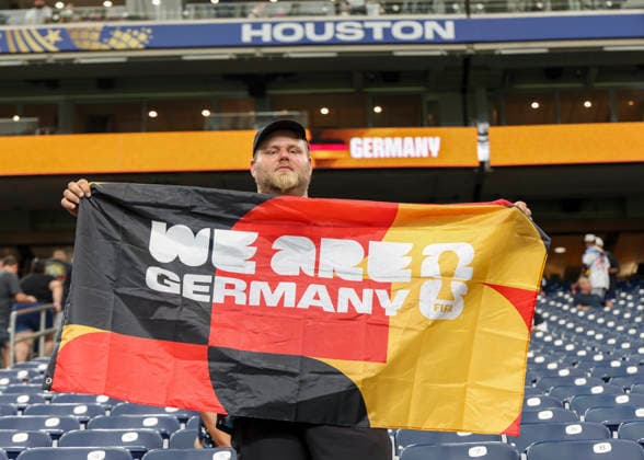 HOUSTON, TX - JUNE 14: Germany fan hold up a team flag during the FIFA World Cup, WM, Weltmeisterschaft, Fussball 2026 Group E match between Germany and Curacao on June 14, 2026 at Houston Stadium in Houston, Texas. (Photo by Leslie Plaza Johnson Icon Sportswire) SOCCER: JUN 14 FIFA World Cup 26 Group E - Germany vs Curacao EDITORIAL USE ONLY Icon260614122