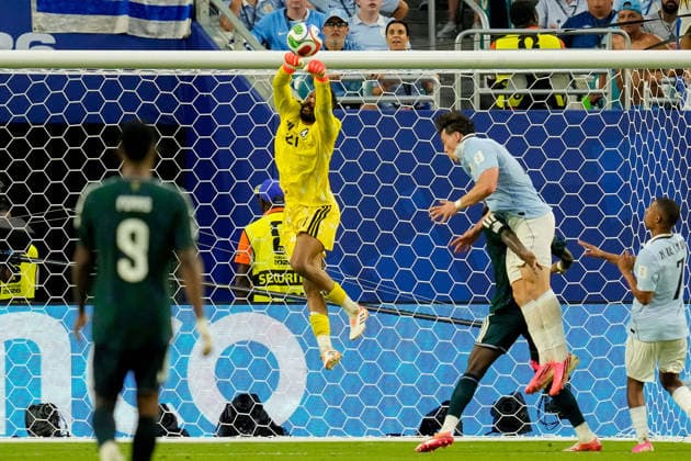 Goalkeeper Mohammed Alowais of Saudi Arabia makes a save during the 2026 FIFA World Cup Group H match between Saudi Arabia and Uruguay at Miami Stadium on June 15, 2026, in Miami, United States. Photo by Alex Gottschalk, DeFodi Images,detected_source_language