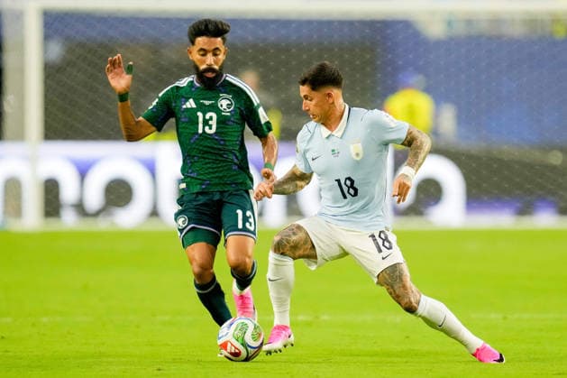 Nawaf Bu Washl of Saudi Arabia and Brian Rodriguez of Uruguay battle for the ball during the 2026 FIFA World Cup Group H match between Saudi Arabia and Uruguay at Miami Stadium on June 15, 2026, in Miami, United States. Photo by Alex Gottschalk, DeFodi Images,detected_source_language