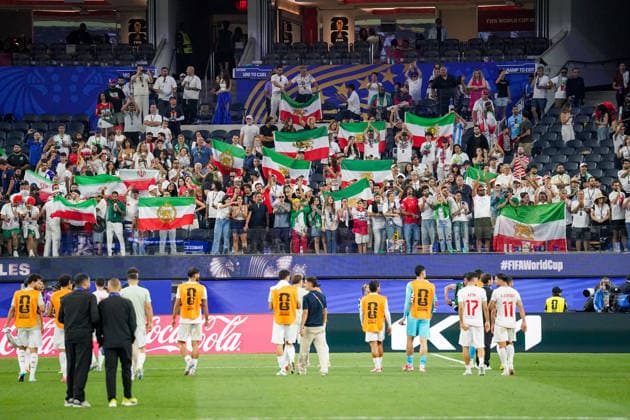 USA Soccer 2026 FIFA World Cup Group Stage Group G Iran vs. New Zealand SoFi Stadium, Inglewood, Los Angeles County, California Iranian fans celebrate their team after the match, with many displaying the historic Lion and Sun flag The pre-revolutionary flag is considered a symbol of the Iranian opposition and is used by many Iranians in exile The motif represents fan culture, the Iranian diaspora, political identity, and solidarity in the context of the 2026 FIFA World Cup,detected_source_language Copyright: xJOERANxSTEINSIEKx
