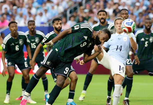 (260616) -- MIAMI, June 16, 2026 -- Feras Albrikan (L, front) of Saudi Arabia and Agustin Canobbio (R, front) of Uruguay compete during the group H match between Saudi Arabia and Uruguay at the 2026 FIFA World Cup, WM, Weltmeisterschaft, Fussball at Miami Stadium, Miami, the United States, June 15, 2026. ) (SP)U.S.-MIAMI-FOOTBALL-FIFA WORLD CUP-GROUP H-KSA VS URU ZhangxChen 