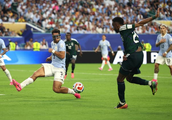 (260616) -- MIAMI, June 16, 2026 -- Sebastian Caceres (L) of Uruguay competes during the group H match between Saudi Arabia and Uruguay at the 2026 FIFA World Cup, WM, Weltmeisterschaft, Fussball at Miami Stadium, Miami, the United States, June 15, 2026. ) (SP)U.S.-MIAMI-FOOTBALL-FIFA WORLD CUP-GROUP H-KSA VS URU XuxZijian 