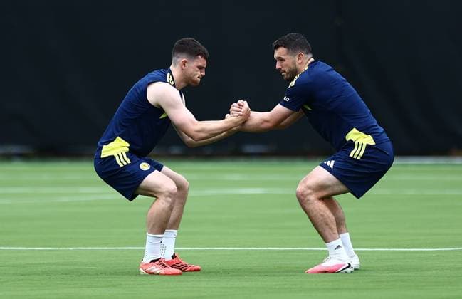 Andy Robertson of Scotland and John McGinn of Scotland Scotland Training and press conference, PK, Pressekonferenz 2026 FIFA World Cup, WM, Weltmeisterschaft, Fussball Football, Atrium Health Performance Park, Charlotte, USA - 16 Jun 2026Charlotte Atrium Health Performance Park United States of America EDITORIAL USE ONLY No use with unauthorised audio, video, data, fixture lists, club league logos or live services. Online in-match use limited to 120 images, no video emulation. No use in betting, games or single club league player publications.  Copyright: xMichaelxZemanek Shutterstockx 16928907ab