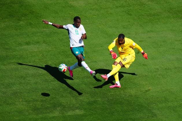 Mike Maignan of France clears ahead of Nicolas Jackson of Senegal France v Senegal, 2026 FIFA World Cup, WM, Weltmeisterschaft, Fussball Group I, Football, New York New Jersey Stadium, East Rutherford, New Jersey, USA - 16 Jun 2026East Rutherford New York New Jersey Stadium New Jersey (NJ) United States of America EDITORIAL USE ONLY No use with unauthorised audio, video, data, fixture lists, club league logos or live services. Online in-match use limited to 120 images, no video emulation. No use in betting, games or single club league player publications.  Copyright: xJavierxGarcia Shutterstockx 16928918ag