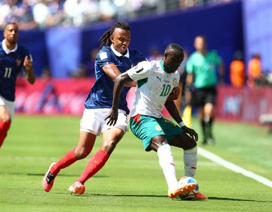New Jersey, USA, 16th June 2026. Jules Kounde of France with Sadio Mane of Senegal during the France vs Senegal FIFA World Cup, WM, Weltmeisterschaft, Fussball match at Metlife Stadium, New Jersey. Picture credit should read: Paul Terry Sportimage EDITORIAL USE ONLY. No use with unauthorised audio, video, data, fixture lists, club league logos or live services. Online in-match use limited to 120 images, no video emulation. No use in betting, games or single club league player publications. SPI_035_PT_France_Senegal SPI-4837-0035