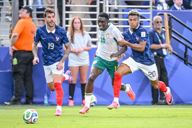 Théo Hernandez (France), Ismaila Sarr (Senegal), and Desire Doue (France) battle for the ball during the 2026 FIFA World Cup Group I match between France and Senegal at New York New Jersey Stadium on June 16, 2026, in East Rutherford, United States. Photo by Harry Langer, DeFodi Images,detected_source_language