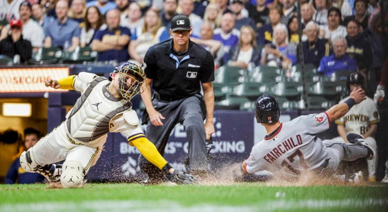 home plate umpire Ryan Additon (C) watches as Cleveland Guardians center fielder Stuart Fairchild (R) scores past Milwaukee Brewers catcher William Contreras (L) on a double hit by Cleveland Guardians third baseman Gabriel Arias in the seventh inning of the MLB, Baseball Herren, USA game between the Cleveland Guardians and the Milwaukee Brewers at American Family Field in Milwaukee, Wisconsin on Tuesday, June 16, 2026.  MIL20260616819 TANNENxMAURY