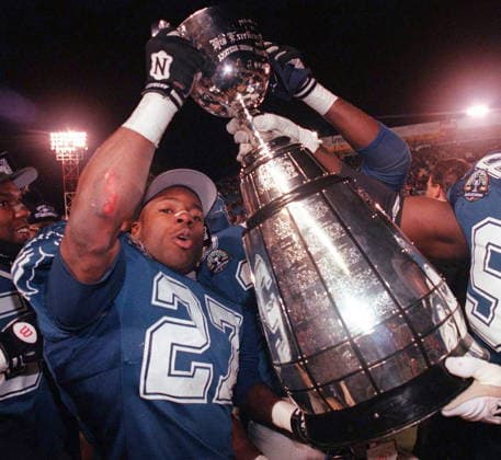 November 19, 1995, Sk, CAN: (GC117) REGINA, NOV. 19 öÄi Baltimore Stallions Mike Pringle hoists the Grey Cup following the Stallions victory over the Calgary Stampeders in Regina Sunday. (CPPhoto) l995 (stf- Canada News - November 19, 1995  - ZUMAc35_ 19951119_zaf_c35_001 Copyright: xTomxHansonx