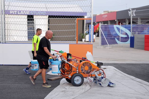Two track marshals on their way to the next turn on the race track, Hainan Island, China, FIA Formula E World Championship Season 12, Sanya E-Prix, China, June 17, 2026, preparations ,detected_source_language