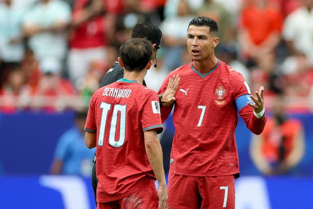 Bernardo Silva (Portugal), referee Abdulrahman Al Jassim, and Cristiano Ronaldo (Portugal) discuss during the 2026 FIFA World Cup Group K match between Portugal and the Democratic Republic of the Congo at Houston Stadium on June 17, 2026, in Houston, United States. Photo by Torbjorn Tande, DeFodi Images,detected_source_language