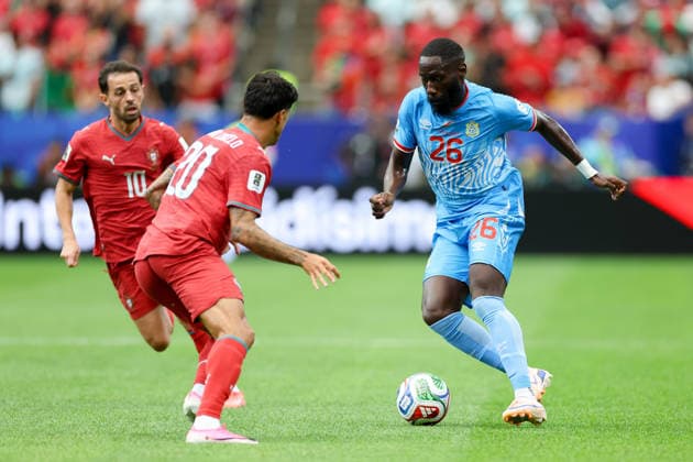 Joao Cancelo of Portugal and Arthur Masuaku of the DR Congo battle for the ball during the 2026 FIFA World Cup Group K match between Portugal and the DR Congo at Houston Stadium on June 17, 2026, in Houston, United States. Photo by Torbjorn Tande, DeFodi Images,detected_source_language
