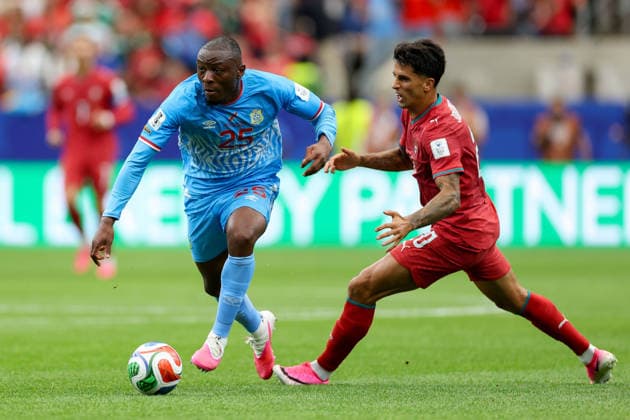 Edo Kayembe of the Democratic Republic of the Congo and Joao Cancelo of Portugal battle for the ball during the 2026 FIFA World Cup Group K match between Portugal and the Democratic Republic of the Congo at Houston Stadium on June 17, 2026, in Houston, United States. Photo by Torbjorn Tande, DeFodi Images,detected_source_language