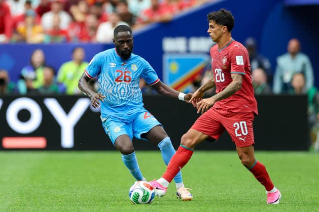 Arthur Masuaku of the Democratic Republic of the Congo and João Cancelo of Portugal battle for the ball during the 2026 FIFA World Cup Group K match between Portugal and the Democratic Republic of the Congo at Houston Stadium on June 17, 2026, in Houston, United States. Photo by Torbjorn Tande, DeFodi Images,detected_source_language