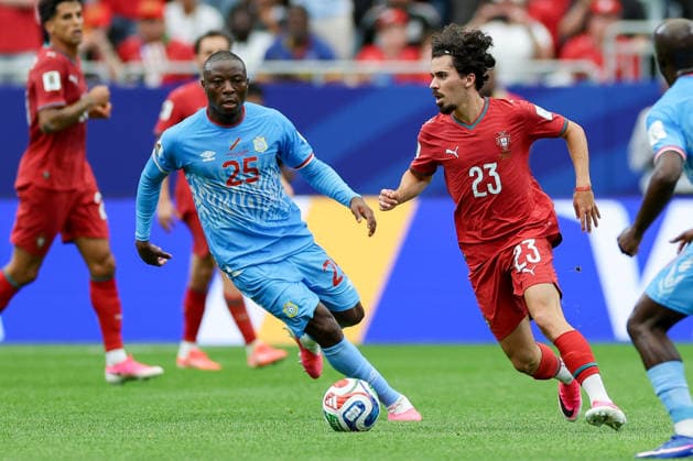 Edo Kayembe of the Democratic Republic of the Congo and Vitinha of Portugal battle for the ball during the 2026 FIFA World Cup Group K match between Portugal and the Democratic Republic of the Congo at Houston Stadium on June 17, 2026, in Houston, United States. Photo by Torbjorn Tande, DeFodi Images,detected_source_language