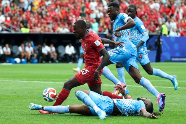 HOUSTON, TX - JUNE 17: Aaron Wan-Bissaka 2 of DR Congo takes the ball away from Nuno Mendes 25 of Portugal with a slide tackle during the FIFA World Cup, WM, Weltmeisterschaft, Fussball 2026 Group K match between Portugal and Congo DR on June 17, 2026, at Houston Stadium in Houston, Texas. (Photo by David Buono Icon Sportswire) SOCCER: JUN 17 FIFA World Cup 26 Group K - Portugal vs Congo DR EDITORIAL USE ONLY Icon260617030