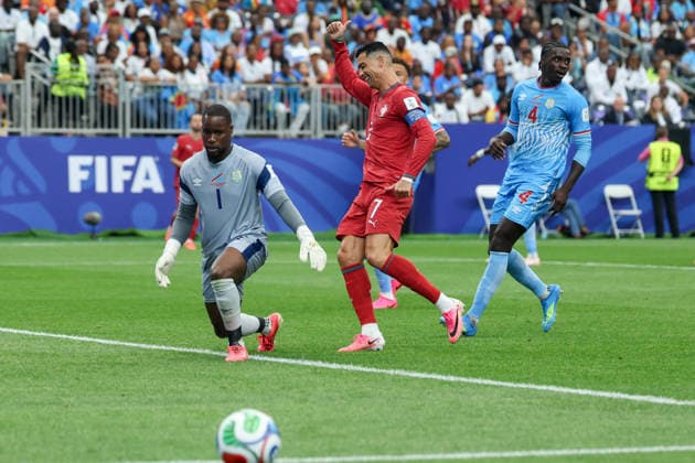 HOUSTON, TX - JUNE 17: Cristiano Ronaldo 7 of Portugal gives a thumps up to a teammate in front of Lionel Mpasi 1 of DR Congo as a crossing ball passes by him during the FIFA World Cup, WM, Weltmeisterschaft, Fussball 2026 Group K match between Portugal and Congo DR on June 17, 2026, at Houston Stadium in Houston, Texas. (Photo by David Buono Icon Sportswire) SOCCER: JUN 17 FIFA World Cup 26 Group K - Portugal vs Congo DR EDITORIAL USE ONLY Icon260617031