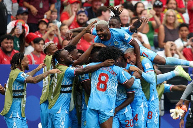 HOUSTON, TX - JUNE 17: Cedric Bakambu 17 of DR Congo leaps on top of teammates to celebrate a goal by Yoane Wissa 20 of DR Congo during the FIFA World Cup, WM, Weltmeisterschaft, Fussball 2026 Group K match between Portugal and Congo DR on June 17, 2026, at Houston Stadium in Houston, Texas. (Photo by David Buono Icon Sportswire) SOCCER: JUN 17 FIFA World Cup 26 Group K - Portugal vs Congo DR EDITORIAL USE ONLY Icon260617036