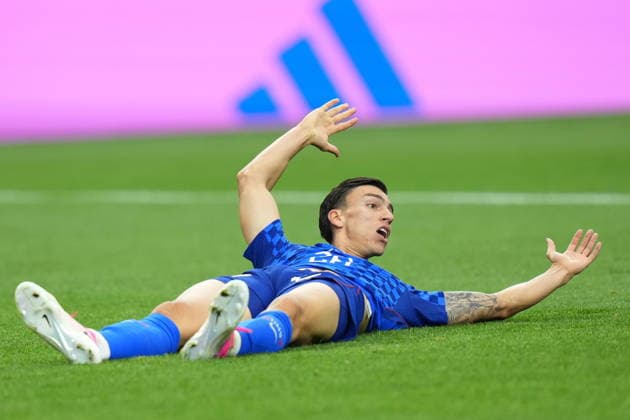 FIFA World Cup, WM, Weltmeisterschaft, Fussball 2026 - Group L - England vs Croatia Petar Musa of Croatia gestures as he lies on the ground during the FIFA World Cup 2026 group stage match England against Croatia, in Dallas, Texas, USA, 17 June 2026. DALLAS United States  Copyright: xJEFFREYxMCWHORTERx