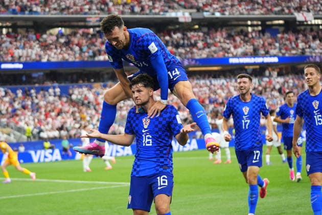 FIFA World Cup, WM, Weltmeisterschaft, Fussball 2026 - Group L - England vs Croatia Martin Baturina of Croatia celebrates scoring the 1-1 goal as his teammate Ivan Perisic jumps over him in celebration during the FIFA World Cup 2026 group stage match England against Croatia, in Dallas, Texas, USA, 17 June 2026. DALLAS United States  Copyright: xJEFFREYxMCWHORTERx
