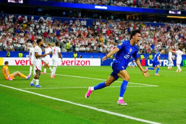 Petar Musa celebrates scoring for Croatia England v Croatia, 2026 FIFA World Cup, WM, Weltmeisterschaft, Fussball Group L, Football, Dallas Stadium, Arlington, Texas, USA - 17 Jun 2026Arlington Dallas Stadium Texas (TX) United States of America EDITORIAL USE ONLY No use with unauthorised audio, video, data, fixture lists, club league logos or live services. Online in-match use limited to 120 images, no video emulation. No use in betting, games or single club league player publications.  Copyright: xJavierxGarcia Shutterstockx 16928920ce