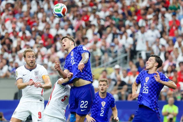 England v Croatia: Group L - FIFA World Cup, WM, Weltmeisterschaft, Fussball 2026 Harry Kane of England and Luka Vuskovic of Croatia jumps for the ball during the FIFA World Cup 2026 Group L match between England and Croatia at Dallas Stadium on June 17, 2026 in Dallas, Texas.  SanjinxStrukic PIXSELL