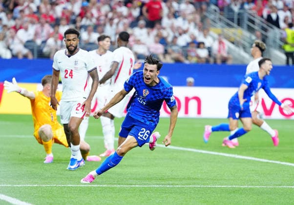 (260618) -- DALLAS, June 18, 2026 -- Petar Musa (front) of Croatia celebrates his goal during the group L match between England and Croatia at the 2026 FIFA World Cup, WM, Weltmeisterschaft, Fussball at the Dallas Stadium in Dallas, the United States, on June 17, 2026. ) (SP)U.S.-DALLAS-FOOTBALL-FIFA WORLD CUP-GROUP L-ENG VS CRO JiaxHaocheng 