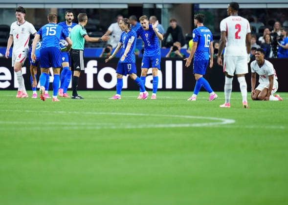 (260618) -- DALLAS, June 18, 2026 -- Luka Modric (5th L) of Croatia communicates with referee Clement Turpin (4th L) during the group L match between England and Croatia at the 2026 FIFA World Cup, WM, Weltmeisterschaft, Fussball at the Dallas Stadium in Dallas, the United States, on June 17, 2026. ) (SP)U.S.-DALLAS-FOOTBALL-FIFA WORLD CUP-GROUP L-ENG VS CRO JiaxHaocheng 