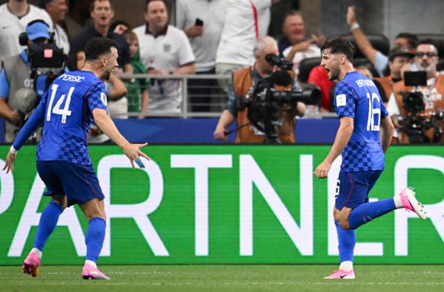 (260618) -- DALLAS, June 18, 2026 -- Martin Baturina (R) of Croatia celebrates his goal during the group L match between England and Croatia at the 2026 FIFA World Cup, WM, Weltmeisterschaft, Fussball at the Dallas Stadium in Dallas, the United States, on June 17, 2026. ) (SP)U.S.-DALLAS-FOOTBALL-FIFA WORLD CUP-GROUP L-ENG VS CRO WuxXiaoling 