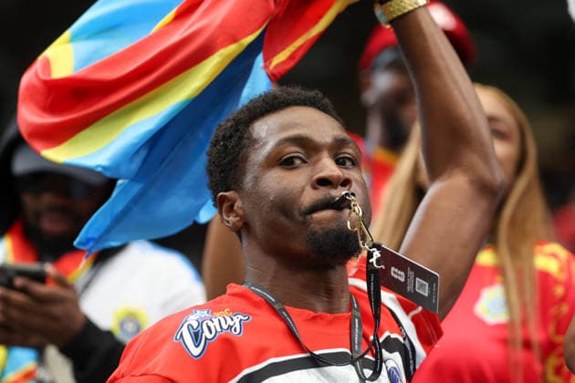 HOUSTON, TX - JUNE 17: A Congo DR fan blows a whistle and waives his country™s flag above his head ahead of the FIFA World Cup, WM, Weltmeisterschaft, Fussball 2026 Group K match between Portugal and Congo DR on June 17, 2026, at Houston Stadium in Houston, Texas. (Photo by David Buono Icon Sportswire) SOCCER: JUN 17 FIFA World Cup 26 Group K - Portugal vs Congo DR EDITORIAL USE ONLY Icon260617077