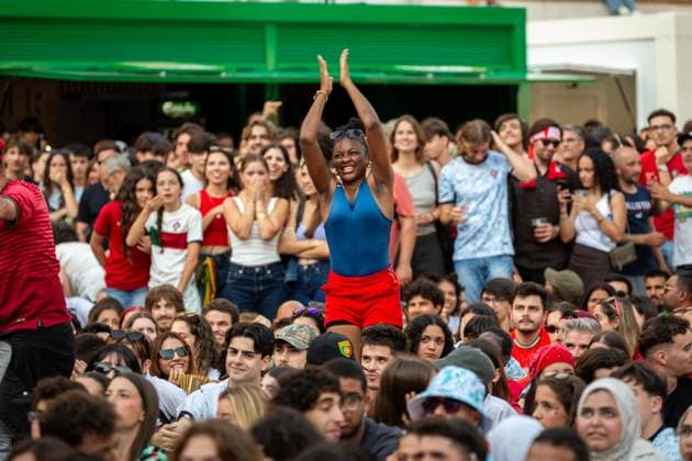 World Cup Fan Zone, Portugal vs DR Congo in Porto, Portugal - 17 Jun 2026 A DR Congo supporter celebrates the team’s first goal while watching the Portugal vs DR Congo World Cup match at the Fan Zone in Praça D. João I. Porto Portugal Copyright: xDiogoxBaptistax xSOPAxImagesx DB_PTvsCONGOWorldcupPorto_0035