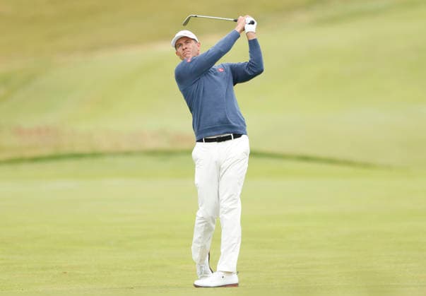 Adam Scott of Australia hits an approach shot to the 1st green during the first round of the 126th U.S. Open Golf Championship at Shinnecock Hills Golf Club in Southampton, NY, on Thursday, June 18, 2026.  NYC20260618817 JOHNxANGELILLO