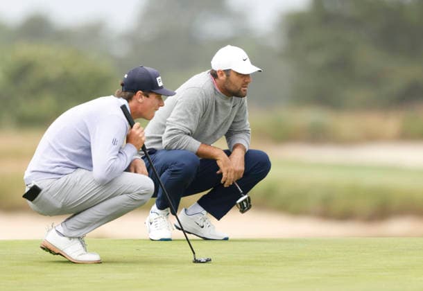 Scottie Scheffler and amateur Mason Howell line up their putt on the 1st green during the first round of the 126th U.S. Open Golf Championship at Shinnecock Hills Golf Club in Southampton, NY, on Thursday, June 18, 2026.  NYC20260618824 JOHNxANGELILLO