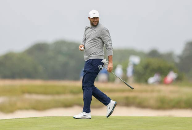 Scottie Scheffler walks off the 1st green after putting for par during the first round of the 126th U.S. Open Golf Championship at Shinnecock Hills Golf Club in Southampton, NY, on Thursday, June 18, 2026.  NYC20260618825 JOHNxANGELILLO