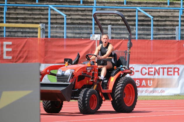 June 18, 2026 Track and Field 28th International Track and Field Meet ANHALT 2026 Training at Paul Greifzu Stadium in Dessau Gina Lückenkemper takes advantage of the time before her training session to take the greenkeepers’ tractor at Dessau’s Paul Greifzu Stadium for a short test drive Stadium, Dessau-Roßlau, Saxony-Anhalt, Germany,detected_source_language