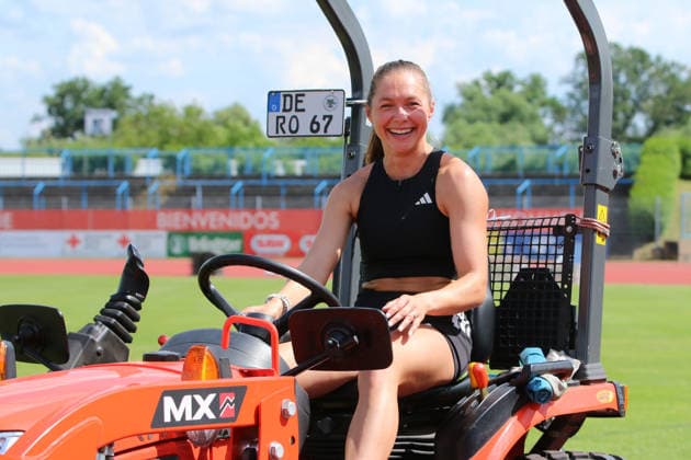 June 18, 2026 Track and Field 28th International Track and Field Meet ANHALT 2026 Training at Paul Greifzu Stadium, Dessau Gina Lückenkemper takes advantage of the time before her training session to take the greenkeepers’ tractor at Dessau’s Paul Greifzu Stadium for a short test drive Stadium, Dessau-Roßlau, Saxony-Anhalt, Germany,detected_source_language