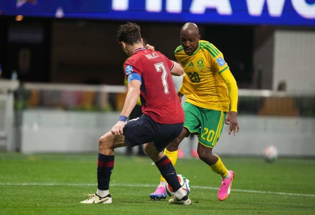 Khuliso Mudau of South Africa and Ladislav Krejci of the Czech Republic battle for the ball during the match between the Czech Republic and South Africa in Group A of the 2026 FIFA World Cup at Atlanta Stadium in Atlanta, United States, on June 18, 2026. Photo by Thor Wegner, DeFodi Images,detected_source_language