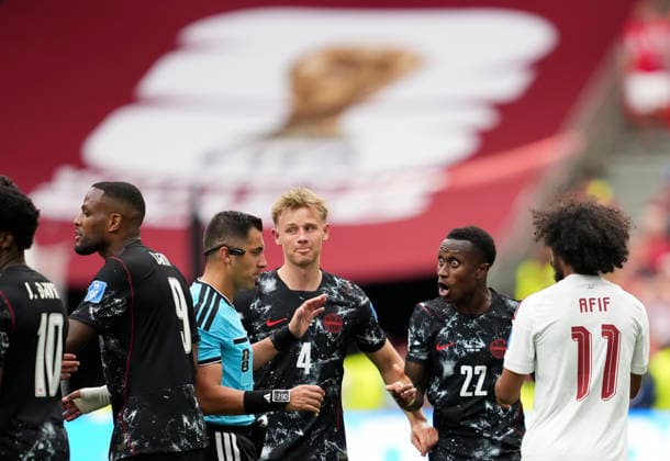 (260619) -- VANCOUVER, June 19, 2026 -- Richie Laryea (2nd R) of Canada argues with referee Cristian Garay (4th R) during the group B match between Canada and Qatar at the 2026 FIFA World Cup, WM, Weltmeisterschaft, Fussball at BC Place Vancouver in Vancouver, Canada, June 18, 2026. ) (SP)CANADA-VANCOUVER-FOOTBALL-FIFA WORLD CUP-GROUP B-CAN VS QAT MengxYongmin 