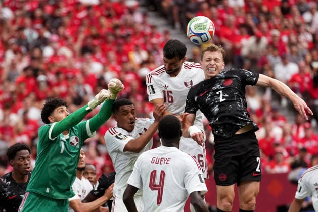 (260619) --VANCOUVER, June 19, 2026 -- Alistair Johnston (1st R) of Canada fights for a head ball during a group B match between Canada and Qatar at the 2026 FIFA World Cup, WM, Weltmeisterschaft, Fussball at BC Place Vancouver in Vancouver, Canada, June 18, 2026. ) (SP)CANADA-VANCOUVER-FOOTBALL-FIFA WORLD CUP-GROUP B-CAN VS QAT MengxYongmin 