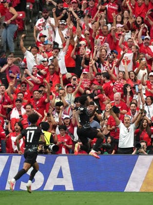 (260619) -- VANCOUVER, June 19, 2026 -- Jonathan David (R) of Canada celebrates his goal during the group B match between Canada and Qatar at the 2026 FIFA World Cup, WM, Weltmeisterschaft, Fussball at BC Place Vancouver in Vancouver, Canada, June 18, 2026. ) (SP)CANADA-VANCOUVER-FOOTBALL-FIFA WORLD CUP-GROUP B-CAN VS QAT MengxYongmin 