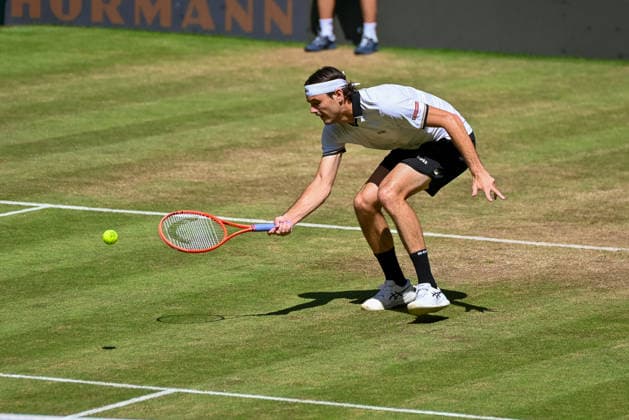 Taylor Fritz (USA) hits a ball at the net at the TERRA WORTMANN Open 2026, Tennis, ATP, Mens 500, Tournament, Main Draw, Quarterfinals, June 19, 2026, TERRA WORTMANN Open 2026, Tennis, ATP, Mens 500, Tournament, Main Draw, Quarterfinals, June 19, 2026, Halle,detected_source_language Copyright: xEibner-Pressefoto RobertxGertzenx EP_RGN