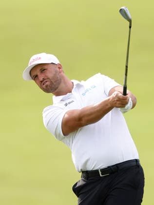 Wyndham Clark hits an approach shot on the 1st fairway during the second round of the 126th U.S. Open Golf Championship at Shinnecock Hills Golf Club in Southampton, NY, on Friday, June 19, 2026.  NYC20260619801 JOHNxANGELILLO