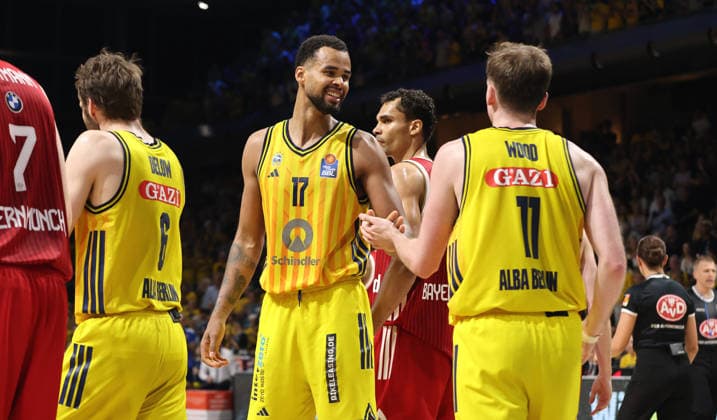 Norris Agbakoko celebrates with Moses Wood. Action. Upper body. Sports. Basketball. BBL. Bundesliga. Mens Playoff Final 4. Game 4. 2025–2026 season. June 19, 2026. ALBA Berlin vs. Bayern Munich,detected_source_language