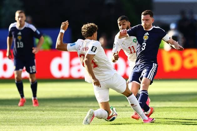 Andy Robertson of Scotland and Neil El Aynaoui of Morocco Scotland v Morocco, 2026 FIFA World Cup, WM, Weltmeisterschaft, Fussball Group C, Football, Boston Stadium, Foxborough, Massachusetts, USA - 19 Jun 2026Foxborough Boston Stadium Massachusetts (MA) United States of America EDITORIAL USE ONLY No use with unauthorised audio, video, data, fixture lists, club league logos or live services. Online in-match use limited to 120 images, no video emulation. No use in betting, games or single club league player publications.  Copyright: xMichaelxZemanek Shutterstockx 16928953ay