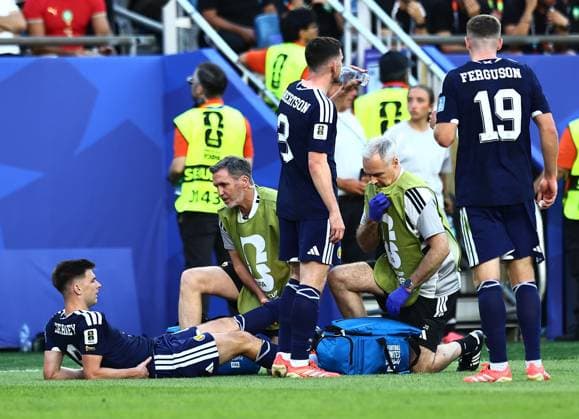 Kieran Tierney of Scotland receives treatment Scotland v Morocco, 2026 FIFA World Cup, WM, Weltmeisterschaft, Fussball Group C, Football, Boston Stadium, Foxborough, Massachusetts, USA - 19 Jun 2026Foxborough Boston Stadium Massachusetts (MA) United States of America EDITORIAL USE ONLY No use with unauthorised audio, video, data, fixture lists, club league logos or live services. Online in-match use limited to 120 images, no video emulation. No use in betting, games or single club league player publications.  Copyright: xMichaelxZemanek Shutterstockx 16928953ck