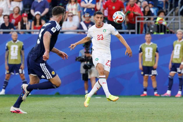 Morocco midfielder Bilal El Khannouss right shoots past Scotland defender Grant Hanley left during the first half of their FIFA World Cup, WM, Weltmeisterschaft, Fussball match at Gillette Stadium in Foxborough, Massachusetts, on Friday, June 19, 2026.  BOP20260619029 CJxGUNTHER