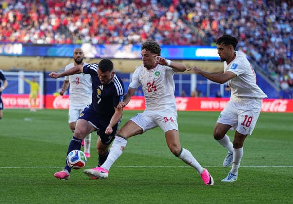 John McGinn of Scotland and Neil El Aynaoui of Morocco battle for the ball during the Scotland vs. Morocco match in Group C of the 2026 FIFA World Cup at Boston Stadium in Boston, USA, on June 19, 2026. Photo by Thor Wegner, DeFodi Images,detected_source_language
