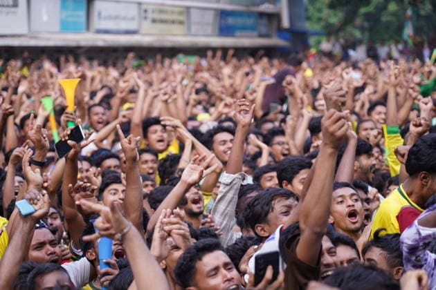 June 20, 2026, Dhaka, Dhaka, Bangladesh: Dhaka, Bangladesh, June 20, 2026: Football fans gather at the Teacher-Student Centre (TSC) of the University of Dhaka to watch the FIFA World Cup, WM, Weltmeisterschaft, Fussball match between Brazil and Haiti on a giant screen in Dhaka, Bangladesh. Thousands of supporters wearing Brazil s yellow and green colors cheered, waved flags, and celebrated throughout the match, creating a festive atmosphere at the venue. Following the game, jubilant fans took part in celebrations and victory processions, reflecting the enduring passion for football among Bangladeshi supporters. Dhaka Bangladesh - ZUMAk185 0859594214st Copyright: xRubelxKarmakerx