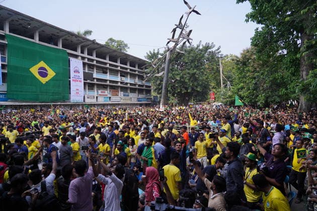 June 20, 2026, Dhaka, Dhaka, Bangladesh: Dhaka, Bangladesh, June 20, 2026: Football fans gather at the Teacher-Student Centre (TSC) of the University of Dhaka to watch the FIFA World Cup, WM, Weltmeisterschaft, Fussball match between Brazil and Haiti on a giant screen in Dhaka, Bangladesh. Thousands of supporters wearing Brazil s yellow and green colors cheered, waved flags, and celebrated throughout the match, creating a festive atmosphere at the venue. Following the game, jubilant fans took part in celebrations and victory processions, reflecting the enduring passion for football among Bangladeshi supporters. Dhaka Bangladesh - ZUMAk185 0859594399st Copyright: xRubelxKarmakerx