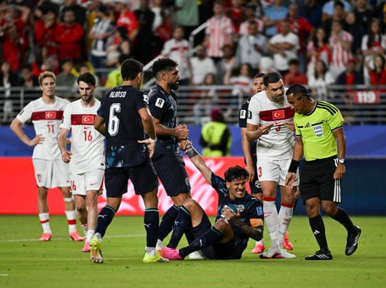 (260620) -- SAN FRANCISCO, June 20, 2026 -- Gustavo Gomez (bottom) of Paraguay is helped by his teammate Omar Alderete (4th L) during the group D match between Paraguay and T¨¹rkiye at the 2026 FIFA World Cup, WM, Weltmeisterschaft, Fussball at San Francisco Bay Area Stadium in San Francisco, the United States, June 19, 2026. (Photo by Xinhua) (SP)U.S.-SAN FRANCISCO-FOOTBALL-FIFA WORLD CUP-GROUP D-PRY VS TUR ZiyuxJulianxZhu 