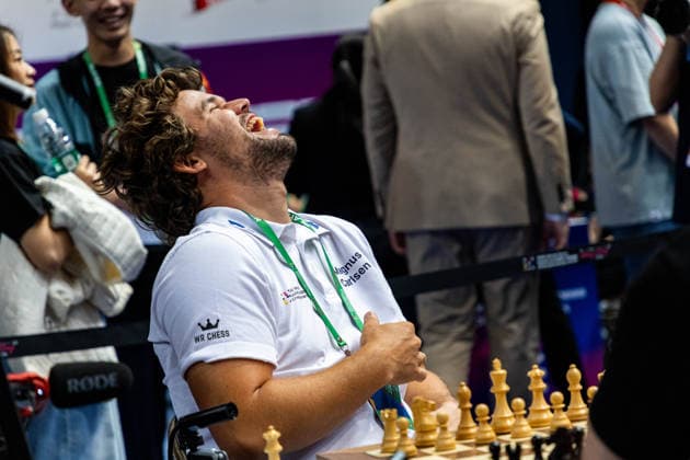 June 20, 2026, Hong Kong, Hong Kong, China: Chess Grandmaster MAGNUS CARLSEN (NOR) laughs while talking with his teammates about chess before a Blitz match at the 2026 FIDE World Team Rapid and Blitz Chess Championship in Hong Kong.Chess Hong Kong China - ZUMAm298 0859595548st Copyright: xJamesxModestox